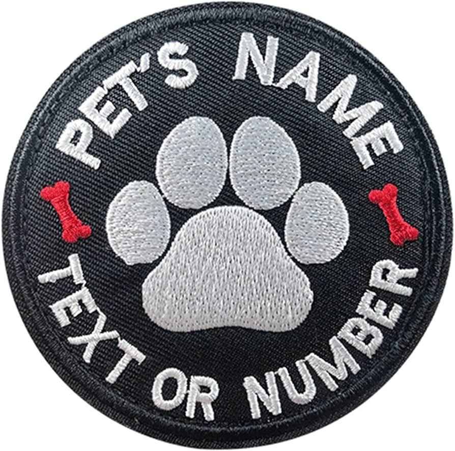 Custom embroidered circular black patch featuring a central grey and white paw print, two red bone graphics, and white text placeholders reading 