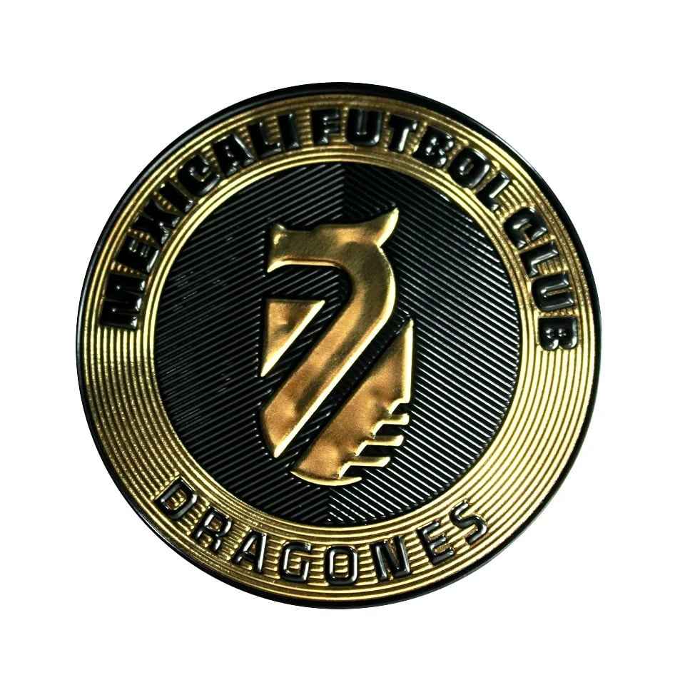Custom metallic gold circular emblem patch for Mexicali Futbol Club Dragones featuring raised 3D text and a stylized central crest.