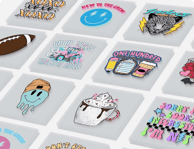 Custom gang sheet layout displaying an assortment of miniature Direct-to-Film (DTF) transfer graphics including cartoon illustrations, typography prints, and colorful designs arranged on a white background.