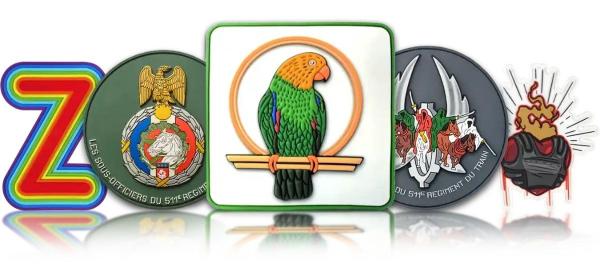 Collection of custom molded PVC patches with colorful emblems and tactical badges.